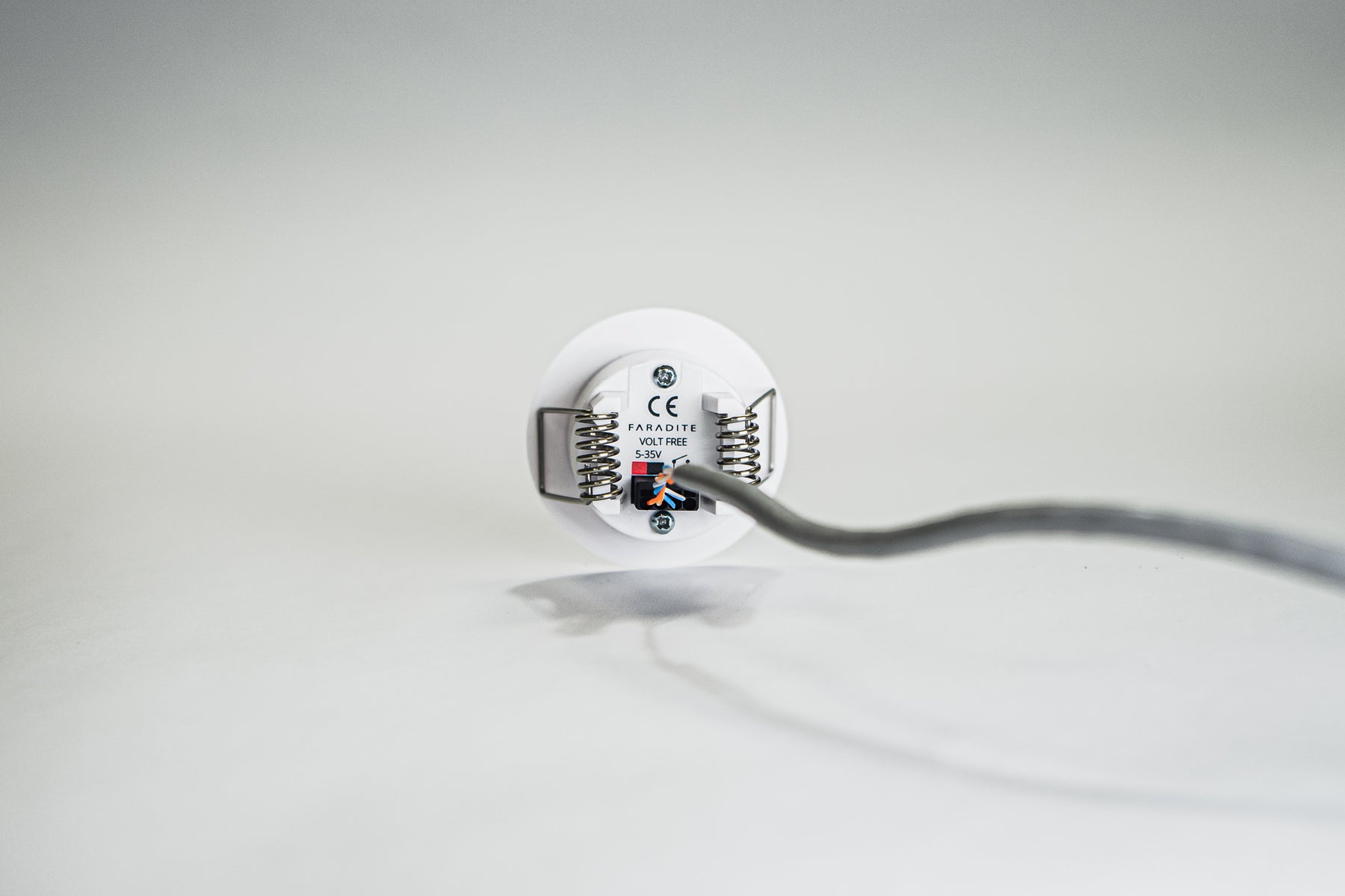 Faradite Motion Sensor dry contact 24V output wired to a Dynalite input.