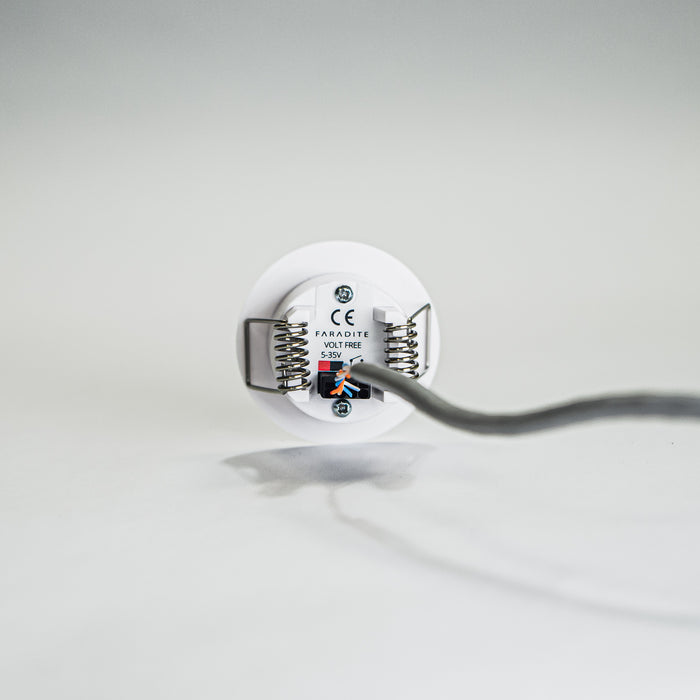 Faradite Motion Sensor dry contact 24V output wired to a Dynalite input.