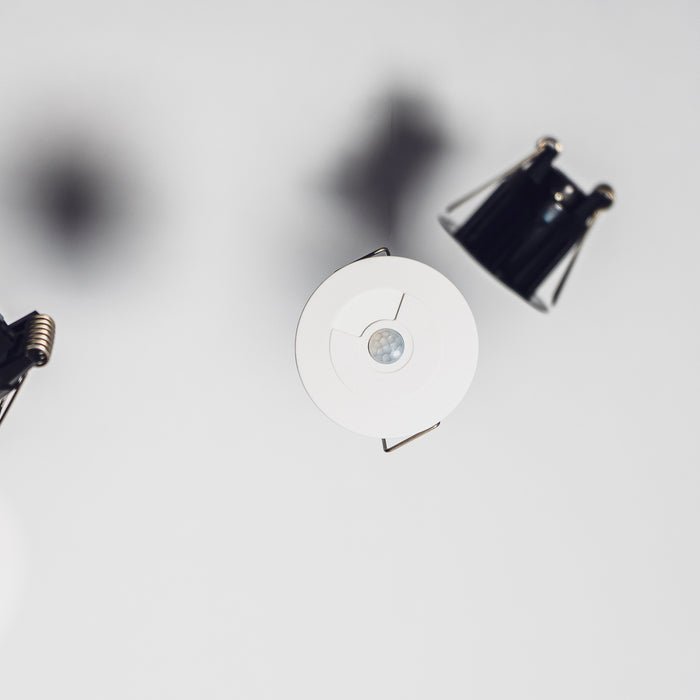 Faradite motion sensors floating in white
